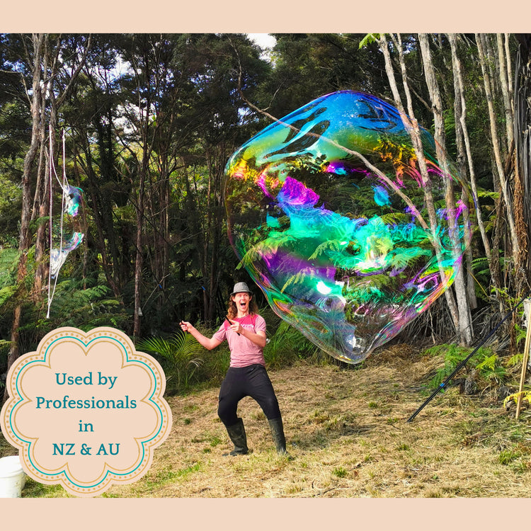 Man blowing a large bubble in a forest with a label stating: Used by Professionals in NZ & AU.