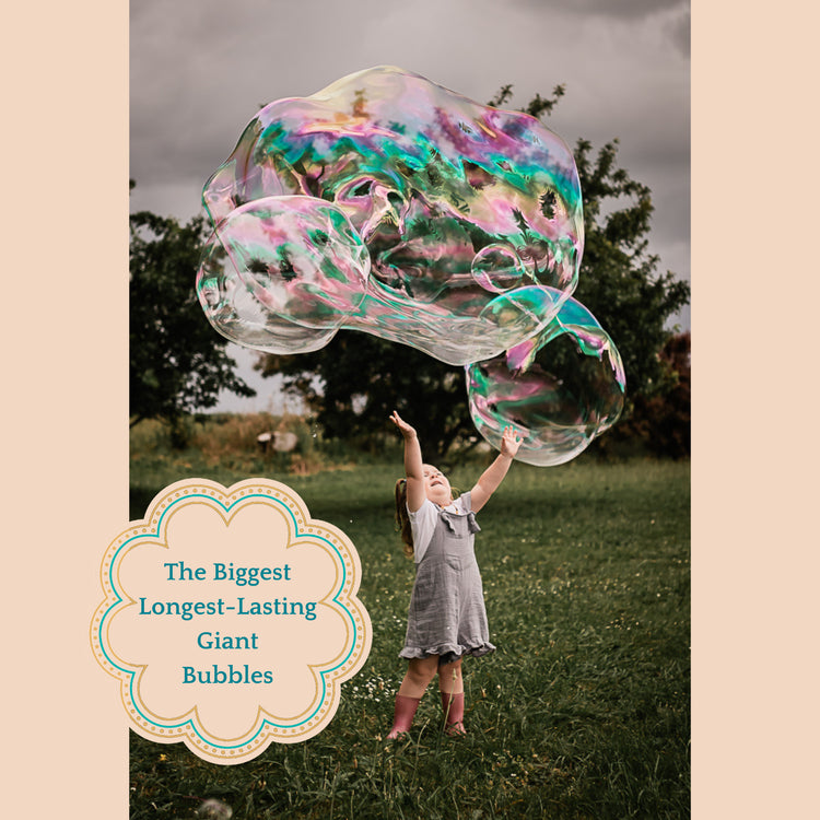 Child playing with giant bubbles in a field with a flower shaped overlay stating: The Biggest Longest-Lasting Giant Bubbles