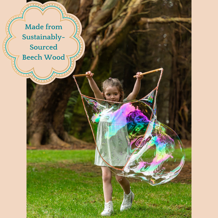 Child holding a large bubble wand making giant bubbles with text about being made with sustainably sourced beech wood